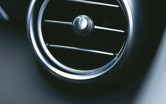 air conditioning — a dashboard air vent, close