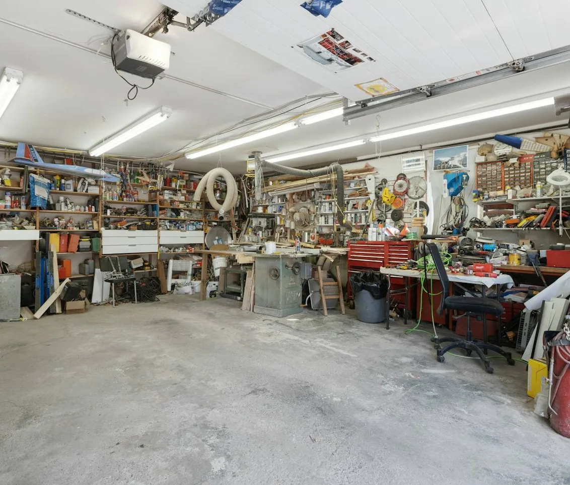 the workshop floor with cars in for work