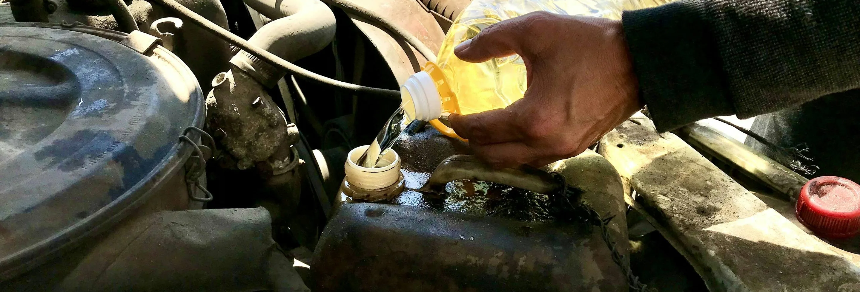 oil going into an engine during a service, wide